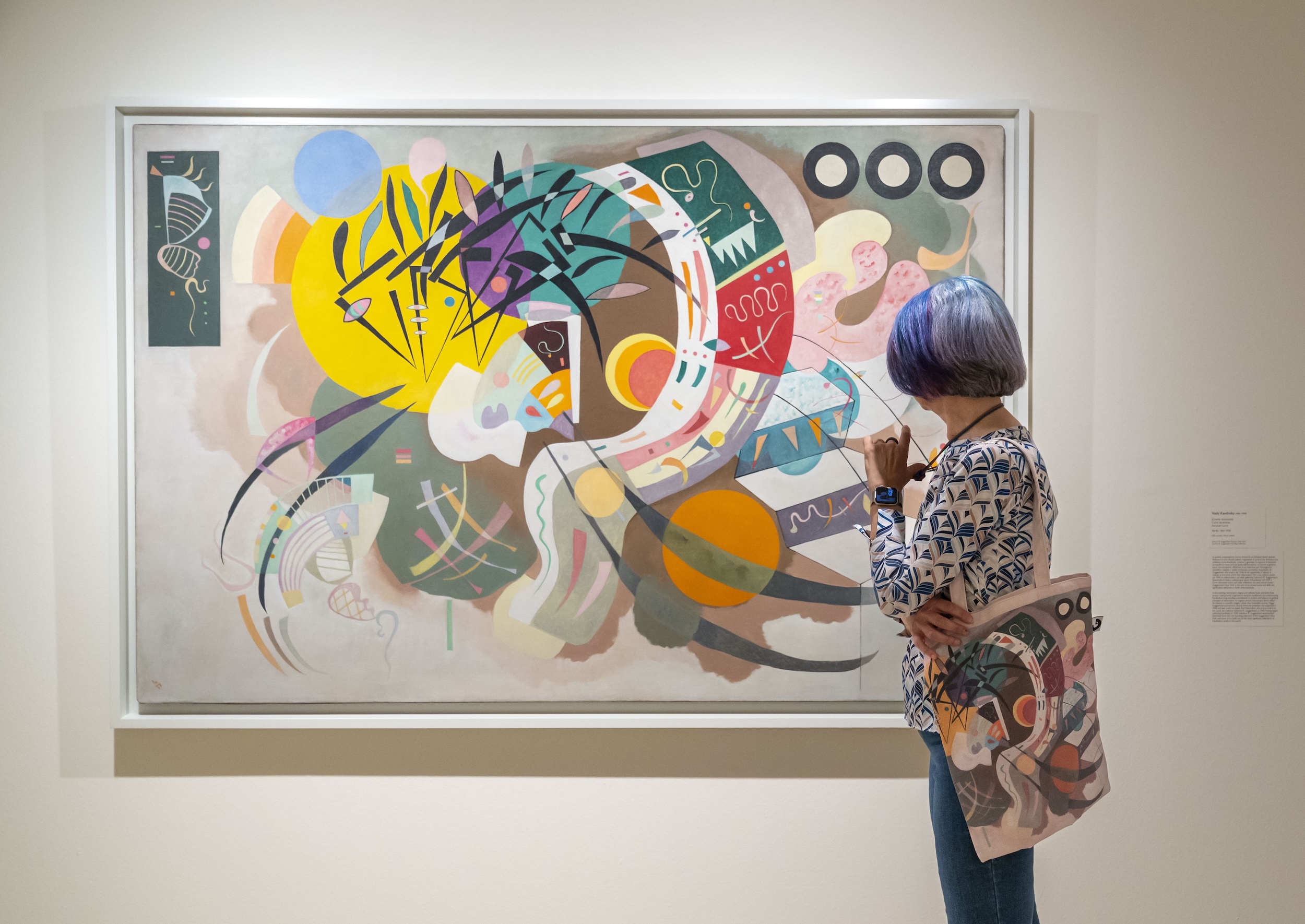 person looking at a painting from the Peggy Guggenheim collection