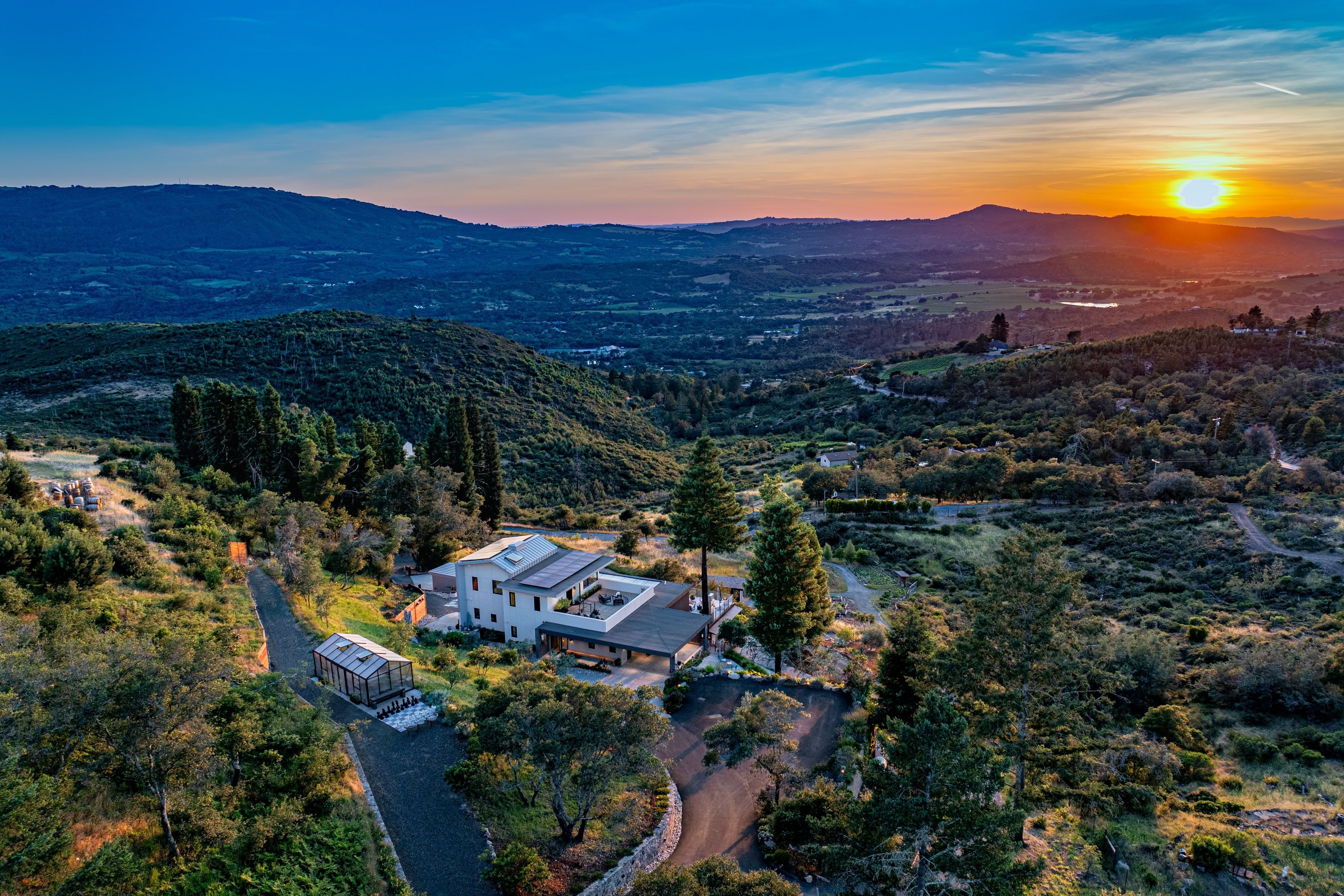 aerial view of contemporary hillside home in Glen Ellen, California at sunset