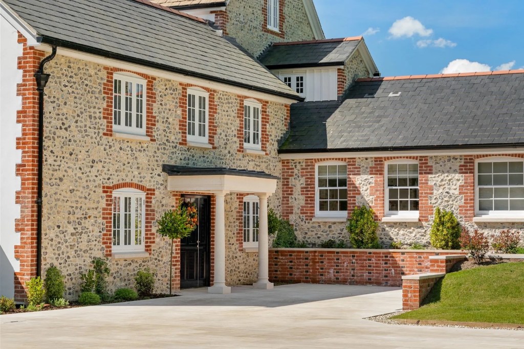 home exterior in Dorset with brick and stone facade with columns