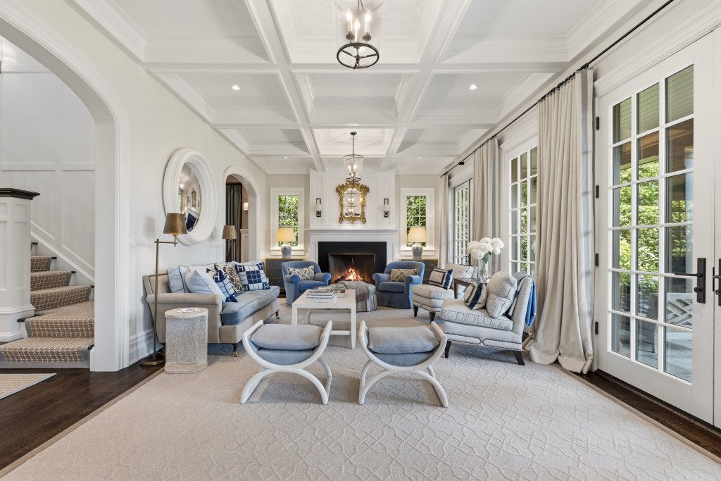 Living room in Greenwich home, all white with blue accents, and french doors