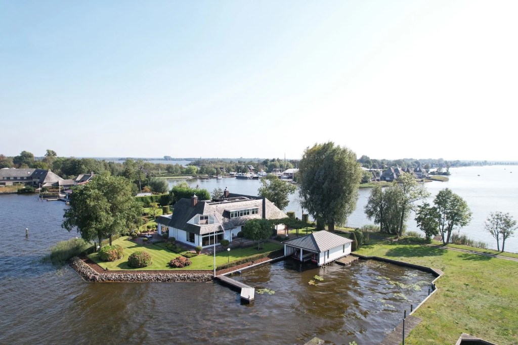 home and boathouse on an inlet in Holland