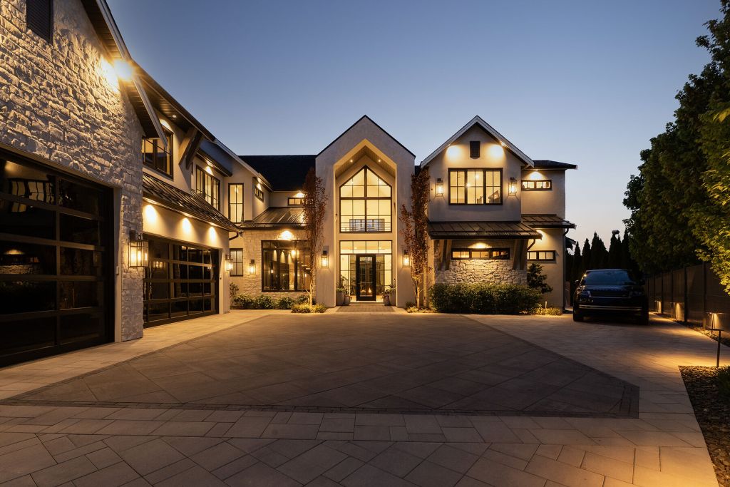 Facade of a contemporary home in Mont-Tremblant, Canada, at sunset.