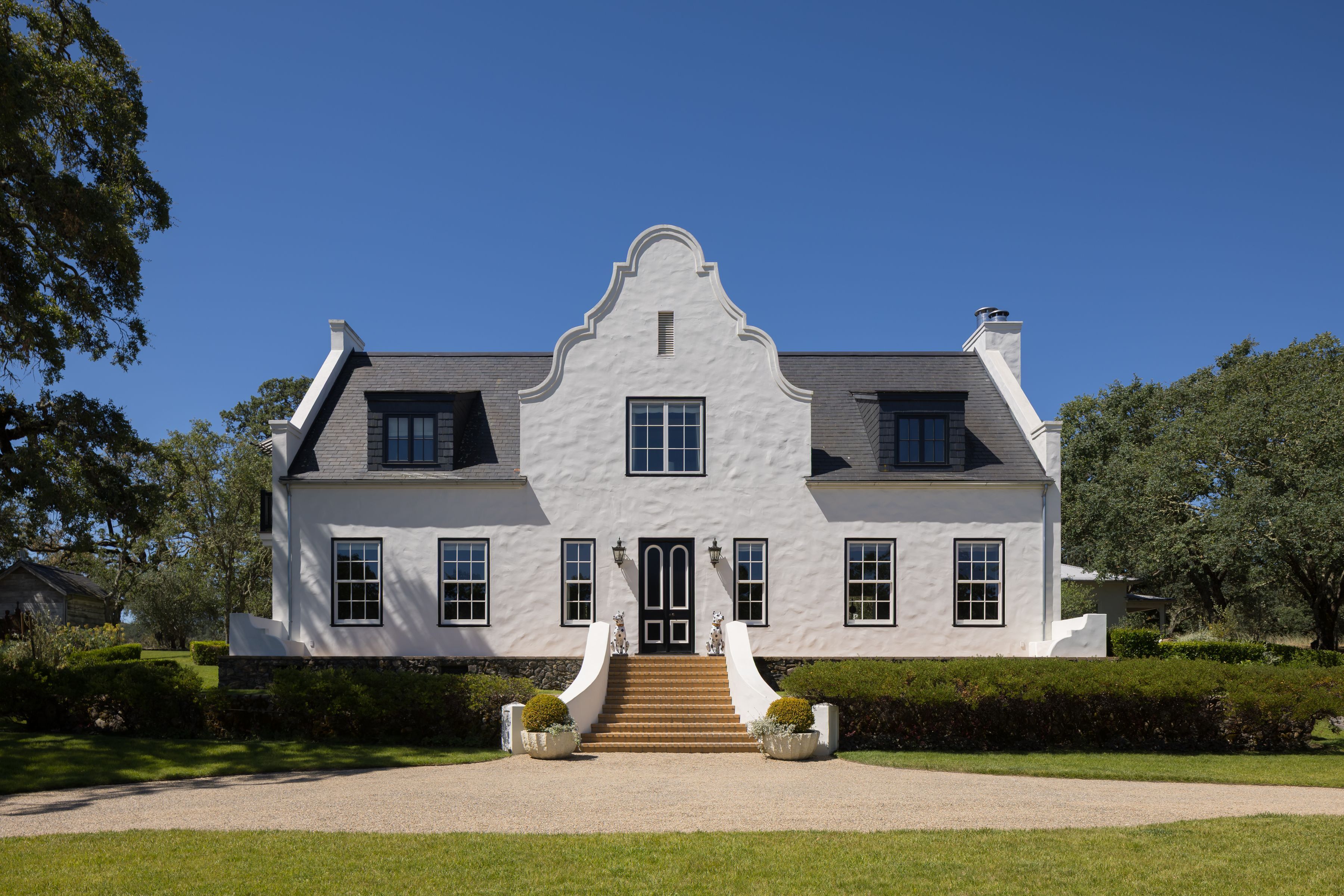 Cape Dutch-style home with white stucco exterior in Glen Ellen, California