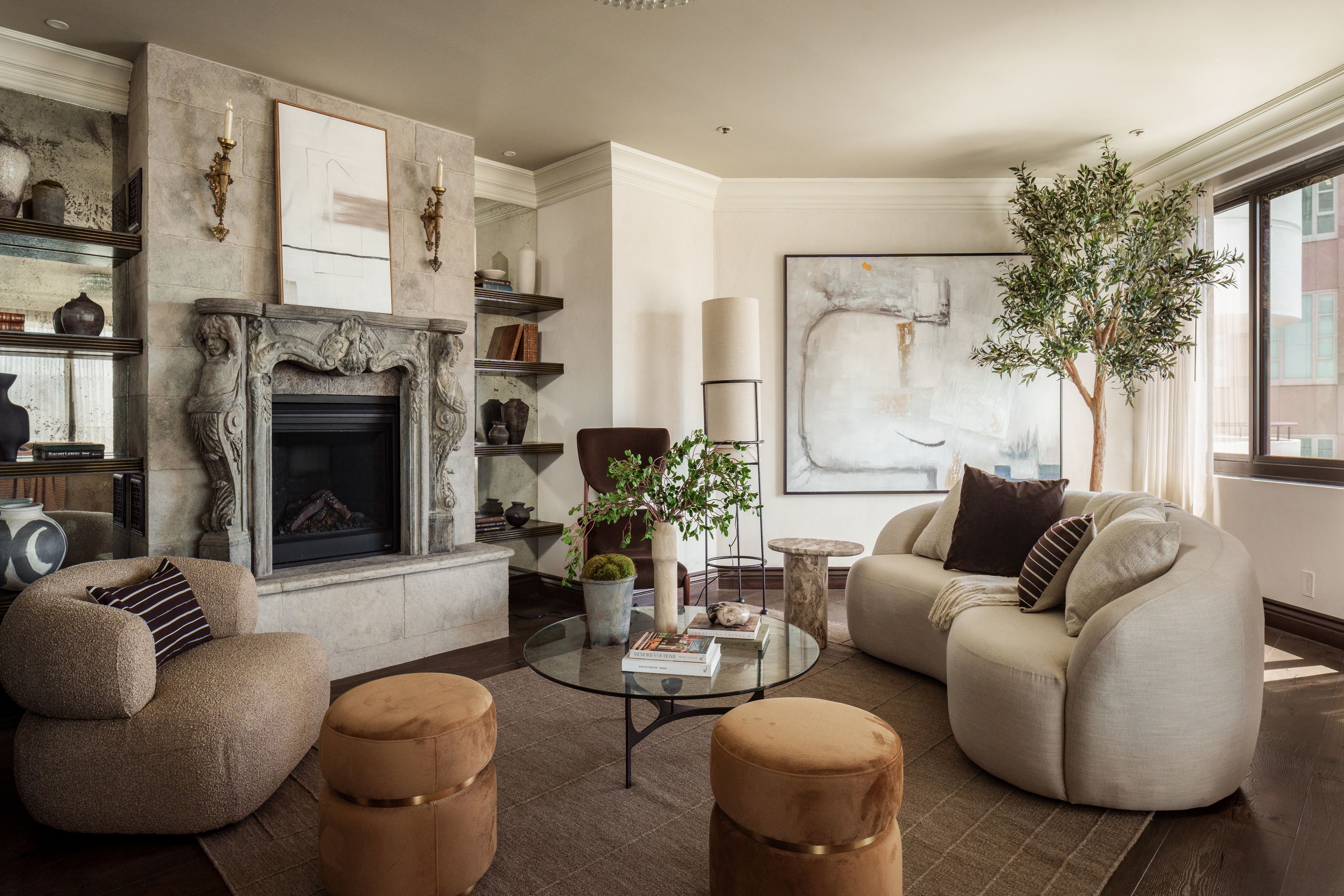 sitting room with ornate stone fireplace in Wilshire Boulevard penthouse
