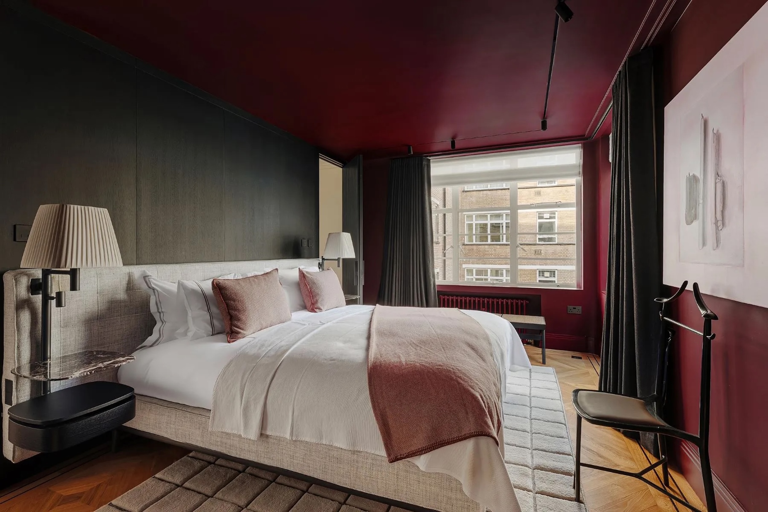 bedroom in London home with burgundy walls