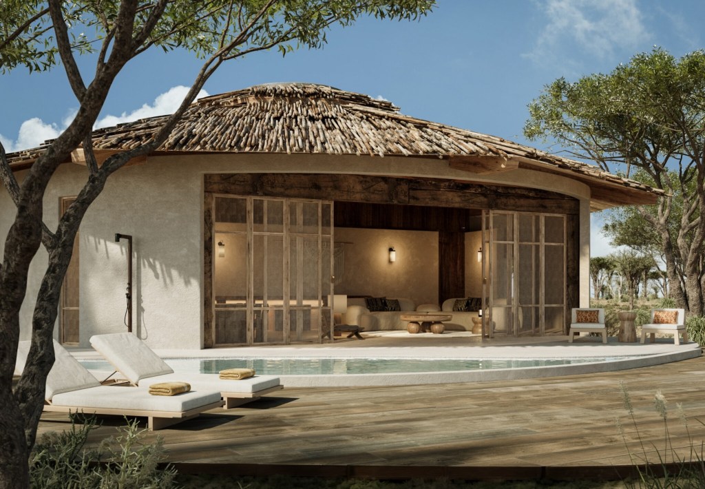 handcrafted luxury villa exterior in Tanzania retreat, featuring natural materials and refined interiors leading out to pool deck from large sliding windows