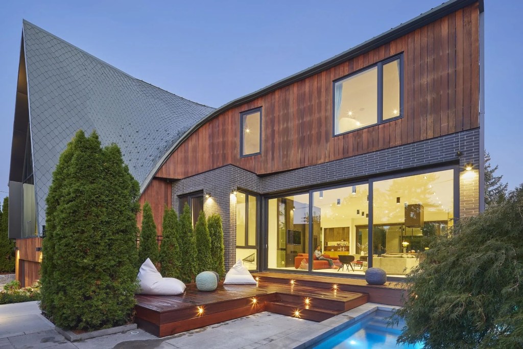 Exterior of home with dramatic roof curvature in the Lawrence Park neighborhood of Toronto, Canada